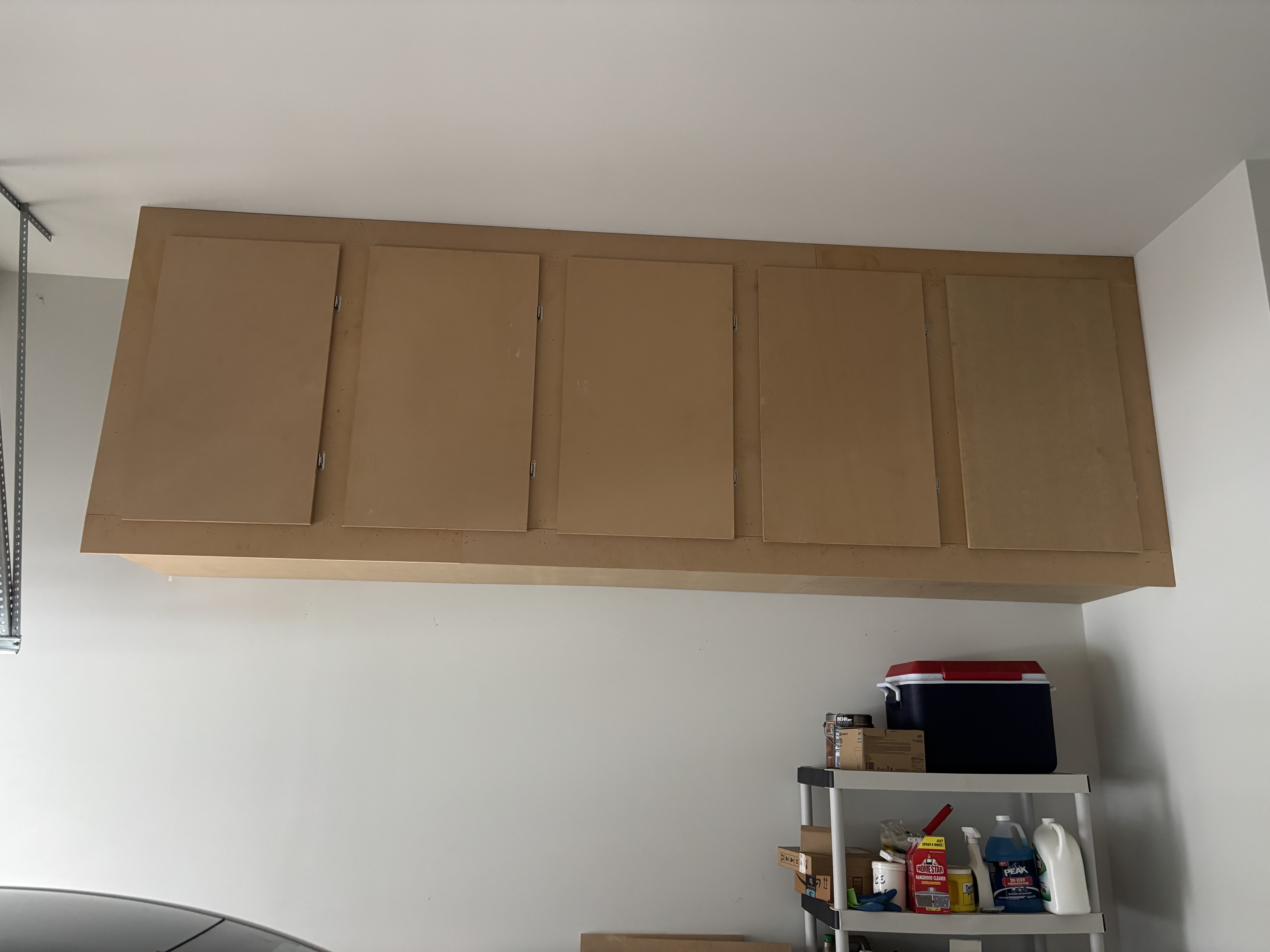 Custom garage cabinet storage system by His Handy Hands