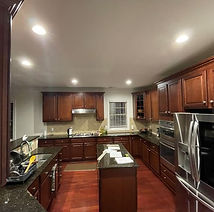 Kitchen with dark cabinets before remodel by His Handy Hands