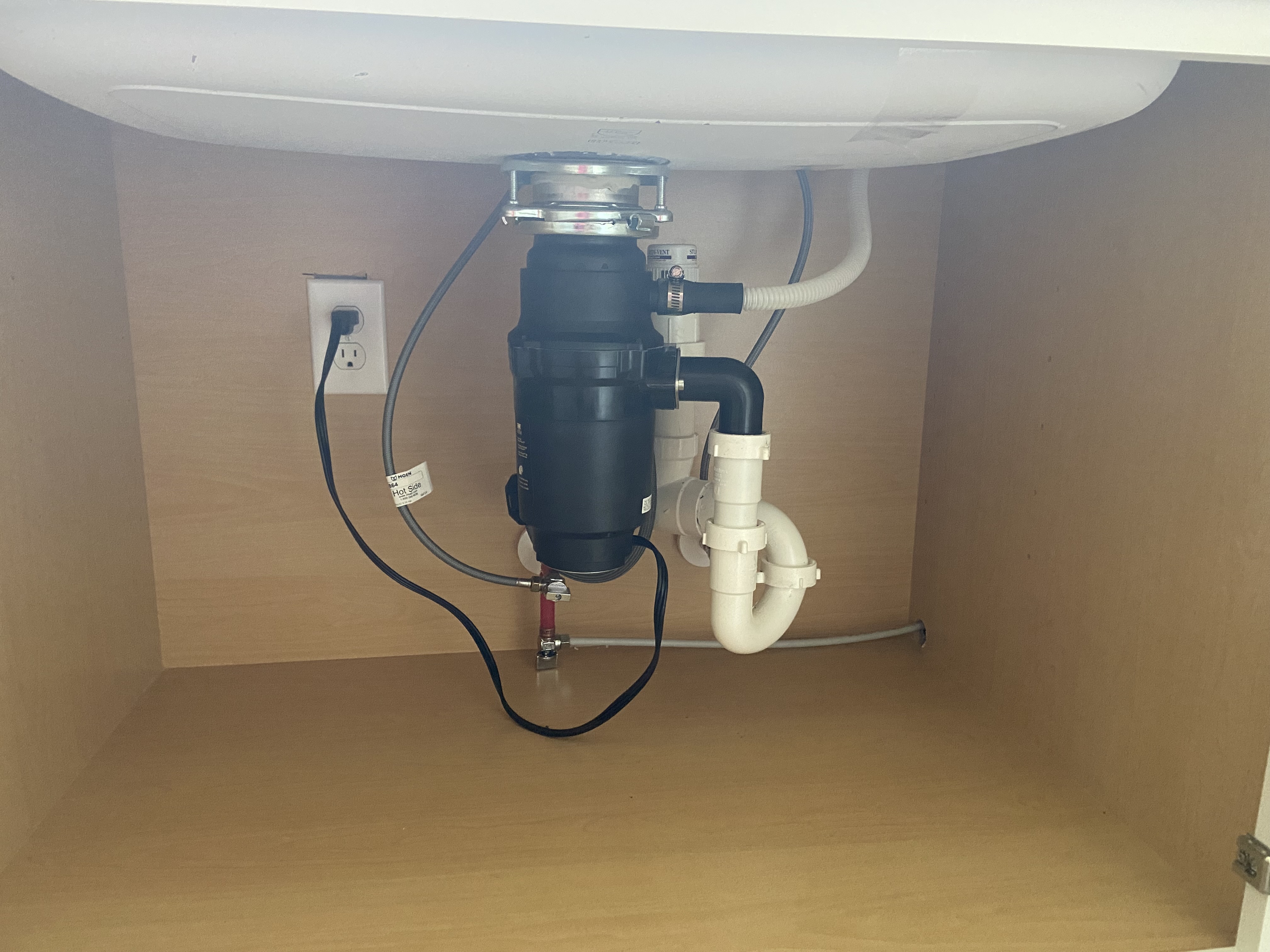 Under-sink area before water purification system installation by His Handy Hands